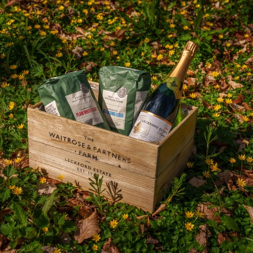 crate of flour and wine outside